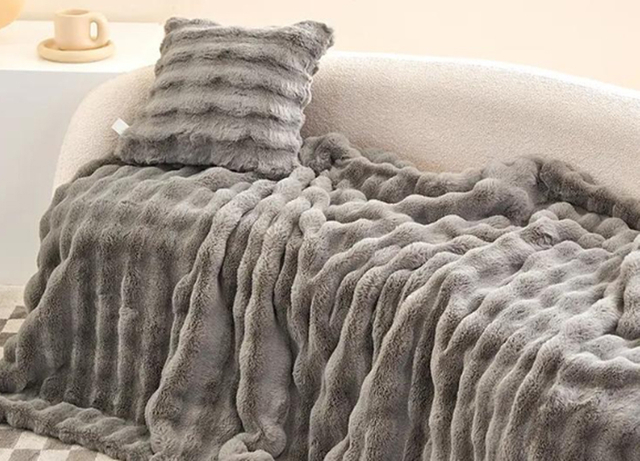 Premium plush fabric blanket in grey ripple texture