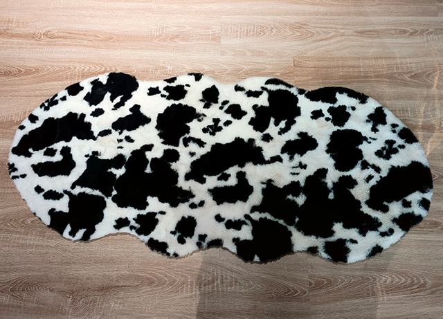 Decorative cow print faux fur area rug design