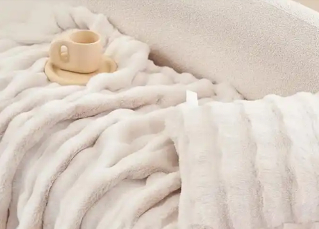 Soft white faux mink throw blanket with texture
